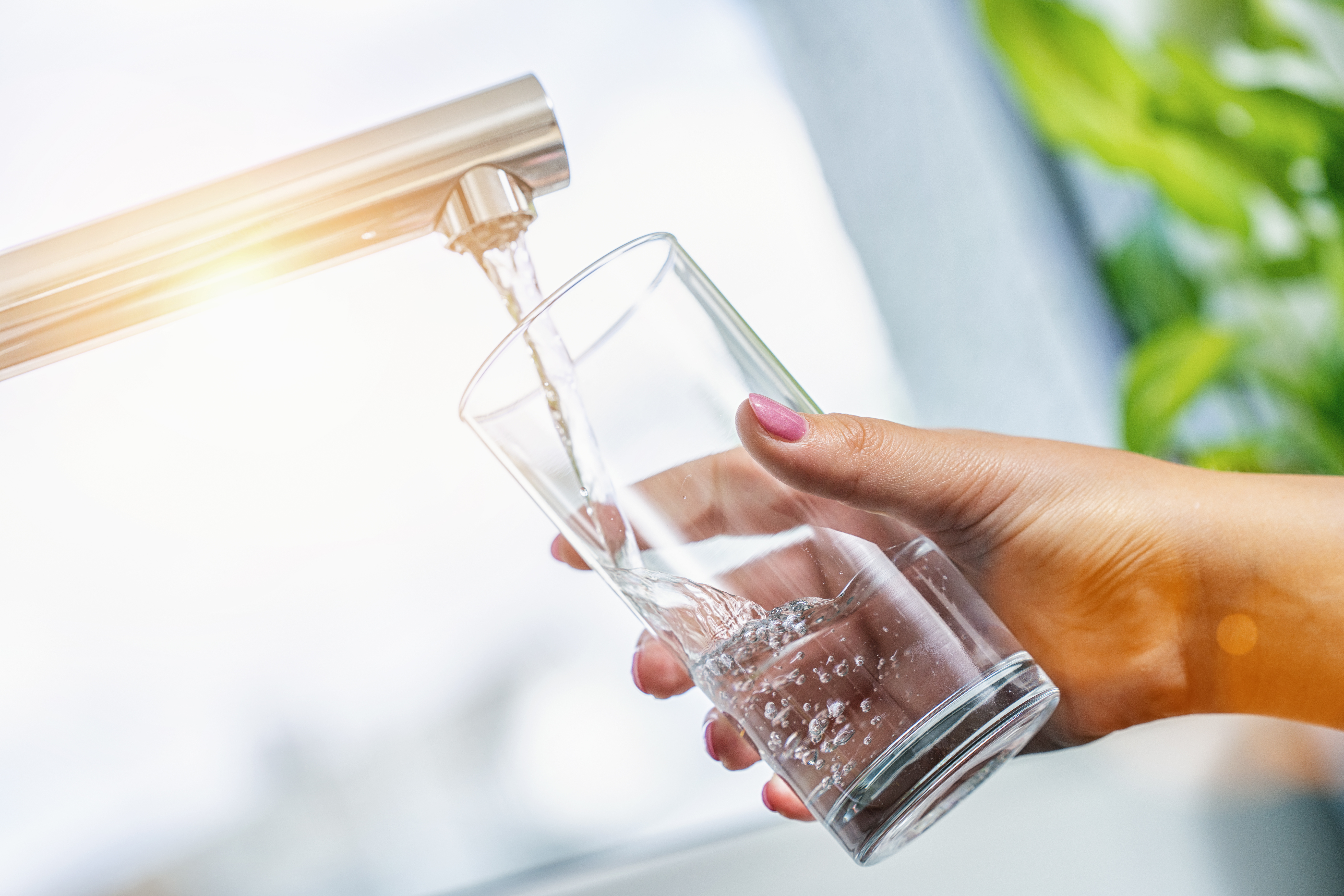 water; tap; glass; drink; kitchen; filling; sink; woman; faucet; lifestyle; hand; clean; home; aqua; beverage; bubbles; clear; nails; cool; cup; finger; fitting; beauty; flowing; fresh; full; health;