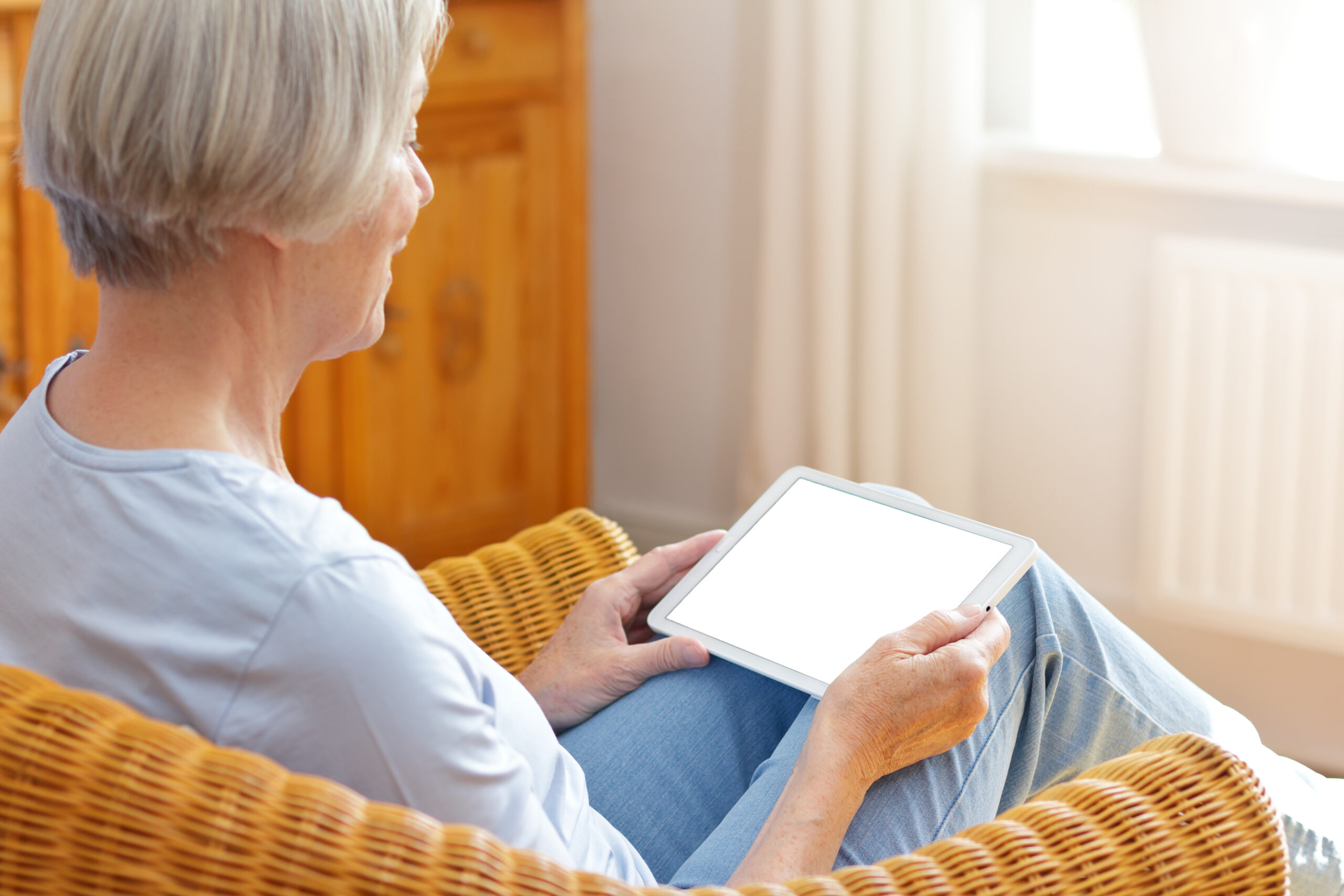 senior woman tablet computer home